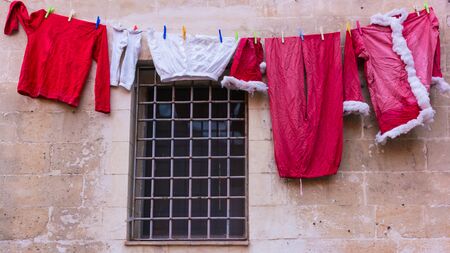Santa Claus clothes on drying rackの写真素材