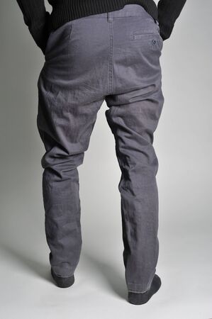 on a guy wearing jeans; view of the waist; guy in the jeans and socks