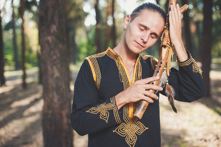 ethnic music, ethnic musician, musician, meditation, wooden musical instruments, the guy playing the ethnic musical instrumentsの写真素材