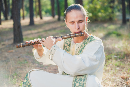 ethnic music, ethnic musician, musician, meditation, wooden musical instruments, the guy playing the ethnic musical instrumentsの写真素材