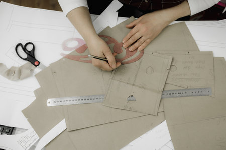 Fashion designer working on new collection of clothes. close-up