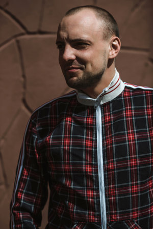 Portrait of a handsome young man in a checkered shirtの写真素材