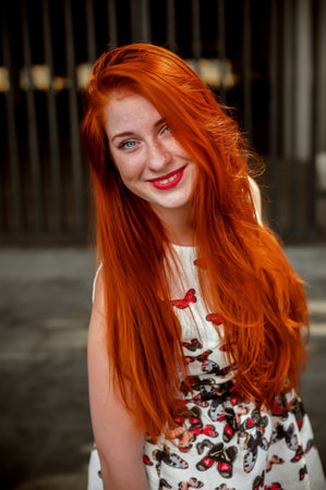 Portrait of a beautiful young redhead woman with frecklesの写真素材