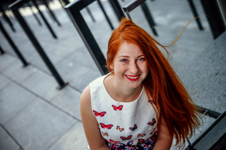 Portrait of a beautiful red-haired girl with frecklesの写真素材