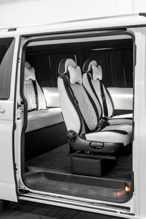 Comfortable interior of a passenger bus with soft seats. The design is made to order. Private covering of cars. Various elements of the bus interior.の写真素材