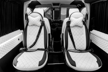 Comfortable interior of a passenger bus with soft seats. The design is made to order. Private covering of cars. Various elements of the bus interior.の写真素材