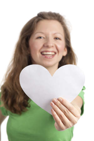 Young woman with a white paperheartの写真素材