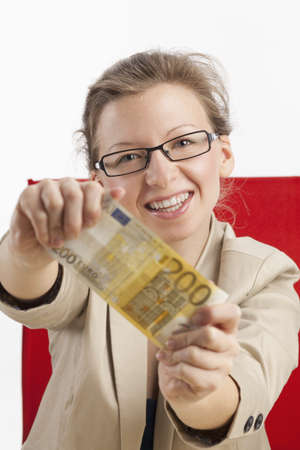 Young woman is happy about hundred eurosの写真素材