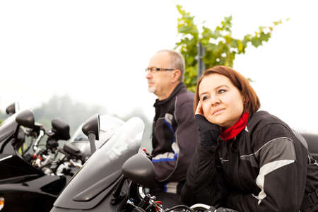 Two motorcyclists taking a breakの写真素材