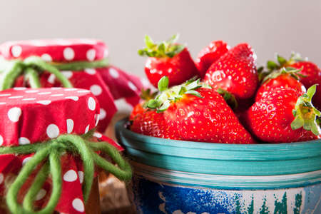 Homemade strawberry jam with fresh strawberriesの写真素材