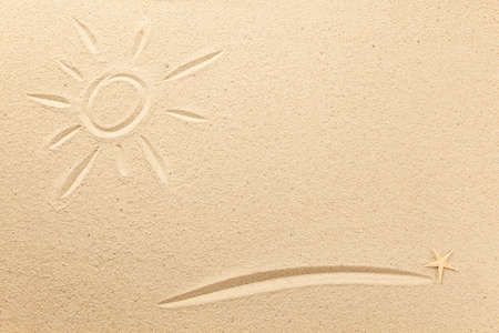 Drawn sun and underline in the sandの写真素材