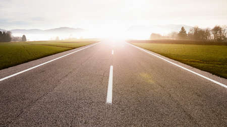 Straight highway in sunriseの写真素材