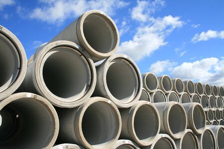 Concrete water pipes stacked in rowsの写真素材