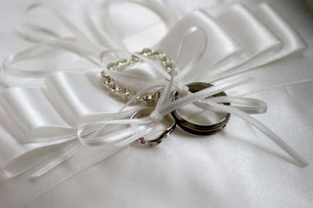 Two wedding ring on a ring cushion with bows very pretty の写真素材
