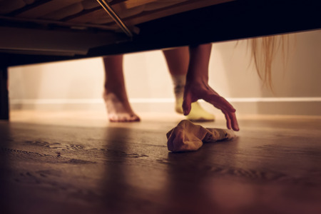 Lady looking for a second sock.の写真素材