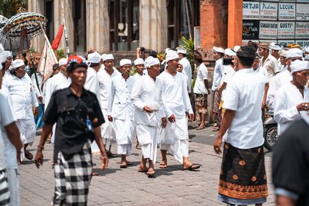 Galungan Holiday. Festive procession in white clothes. Bali Island, Indonesia. 26.12.2018のeditorial素材