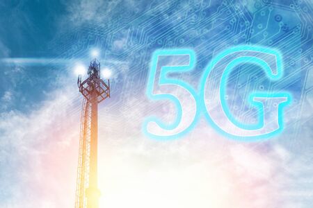 Telecommunications antenna against a clear blue sky with the image of a chip and 5G. The concept of communication, technologies and telecommunications.の写真素材