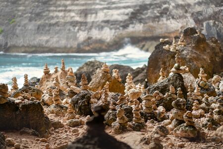 Pyramids of stones on the island of Nusa Penida, Bali. Ocean on the background.の写真素材