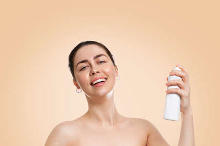 A doctor or nurse in medical gloves and a red superhero Cape on a gray background, rushes to help. The concept of a super hero power for clinics and hospitals. Copy space.の写真素材