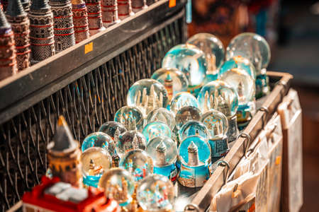 A table in a street market with glittering glass balls with figures.の写真素材