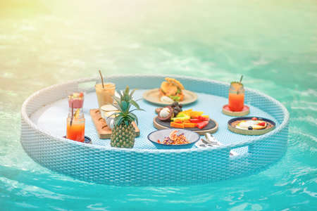 Delicious Breakfast on the floating table in the poolの写真素材