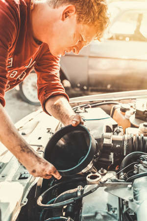 The concept of disability of people and their adaptation to life. Disabled c funnel for engine oil...