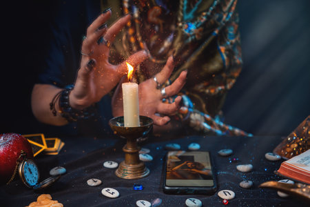 Future and online divination. A fortune teller does online fortune telling on photos from a...