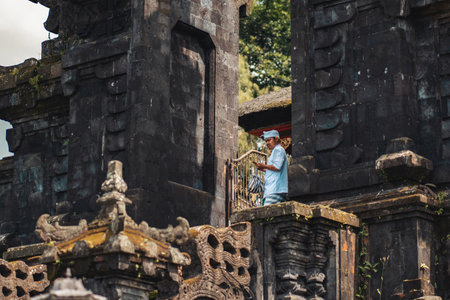 12/26/2018, Bali, Indonesia. A man stands at the entrance to the temple. Bali temple close-up....