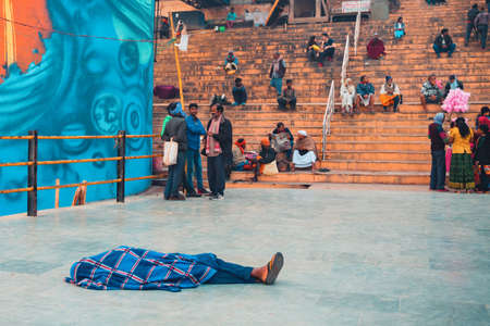 12/17/2019, Varanasi, India. Daily life of the Indian population. a man sleeps or meditates on the...