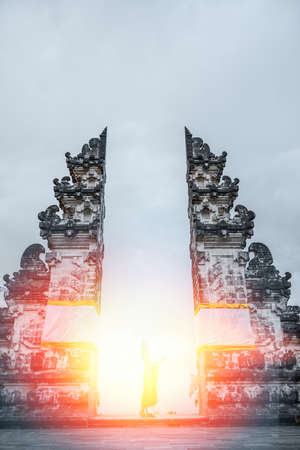 Silhouette of woman standing at sunlight. Lempuyang Temple, Bali Indonesia.の写真素材