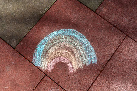 A child's drawing of a rainbow drawn with crayons. Flat lay. Concept of peace.の写真素材
