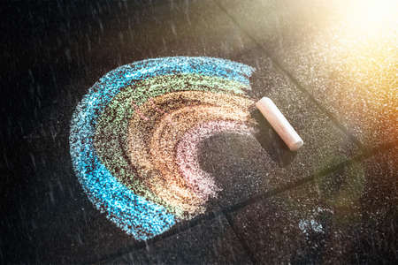 A child's drawing of a rainbow drawn with crayons. Top view. The concept of a happy childhood.の写真素材