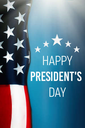 National holidays of the United States of America. Happy president's day with flag of the USA on blue background. Flat lay, vertical orientation. concept of patriotism.の写真素材