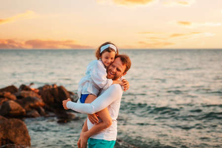 father's day. Portrait of embrasing happy father and daughter have a funny time. On the background...