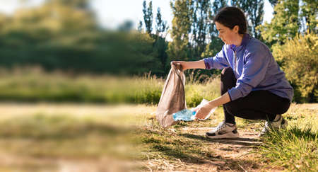 Plogging banner with copy space. Woman in sportswear jogging at the forest, holding a bag of garbage...
