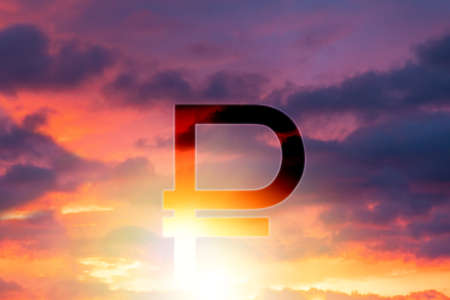 The symbol of the Russian ruble against the background of a beautiful sunset or sunrise in the sky. double exposure. The concept of investment, banking and the crisis.の写真素材