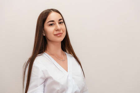 Portrait of young pretty caucasian woman on white background. executive specialist.