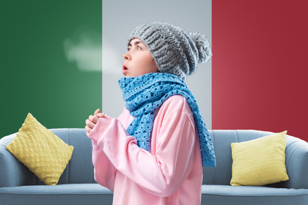 The energy crisis in Europe. An Italian woman in a hat and scarf is breathing and coughing. In the background is the flag of Italy. Concept of sanctions, refusal of gas and renewable energy sources.の写真素材