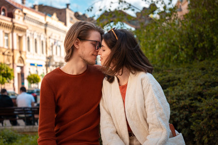 Portrait of young Caucasian couple relax in the park. Romantic date in Valentine's Day.の写真素材