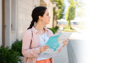 Web banner of travel. Portrait of young Caucasian woman holding paper map and looking for way. Mock...