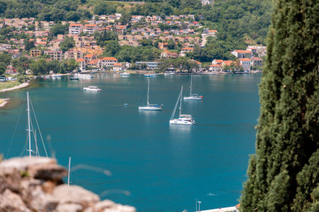 Panoramic view from above of bay with boats. Summer holidays at Mediterranean resort. View from the cypress.の写真素材