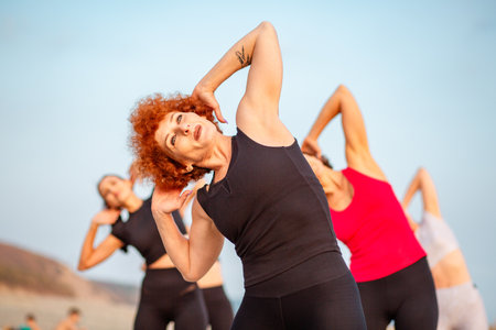 Portrait of adult Caucasian woman training in outdoor. Concept of fitness and yoga.