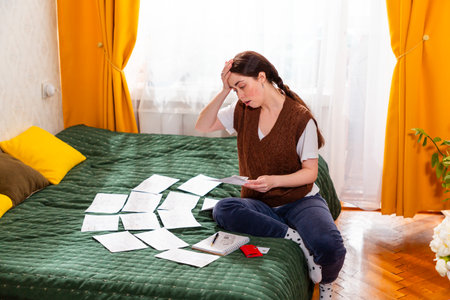 Woman analyzing expenses and planning financial strategies for long-term security. concept of financial literacy and responsible economy.の写真素材