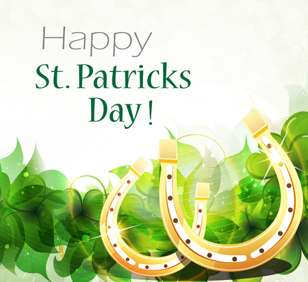 Golden horseshoes on clover background with place for text.  St. Patrickのイラスト素材