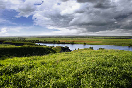 Coast of the river and boat in a sunny dayの写真素材
