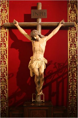jesus on a cross over the red backgroundの写真素材