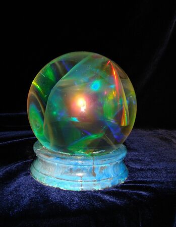 a beautiful magic crystal sphere over the blue backgroundの写真素材