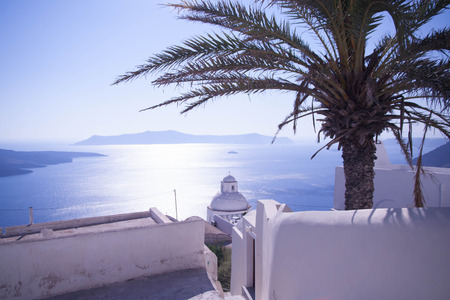 view from the island of Santorini, Greece - sun, blue sky, sea and rocksの写真素材