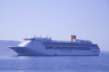 cruise ship anchored, blue sea and Santorini island, Greece, Europeのeditorial素材