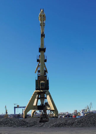 Cranes and charcoal in port with blue sky background - cargo / industry / transport / Constanta portの写真素材
